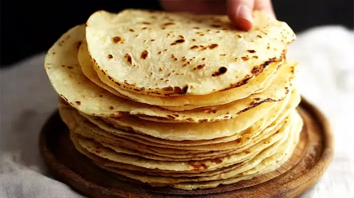 corn tortillas recipe freshly made stack with char marks on wooden surface