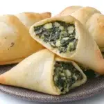 Golden Lebanese spinach fatayer pastries filled with a savory spinach mixture and baked until perfectly crisp.