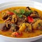 Nigerian pepper soup with flavorful broth, tender meat, and aromatic spices served hot in a bowl
