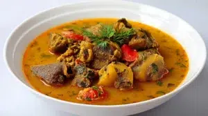 Nigerian pepper soup with flavorful broth, tender meat, and aromatic spices served hot in a bowl