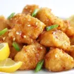 Chinese lemon chicken served with crispy golden chicken pieces coated in a glossy sweet and tangy lemon sauce.