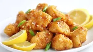 Chinese lemon chicken served with crispy golden chicken pieces coated in a glossy sweet and tangy lemon sauce.