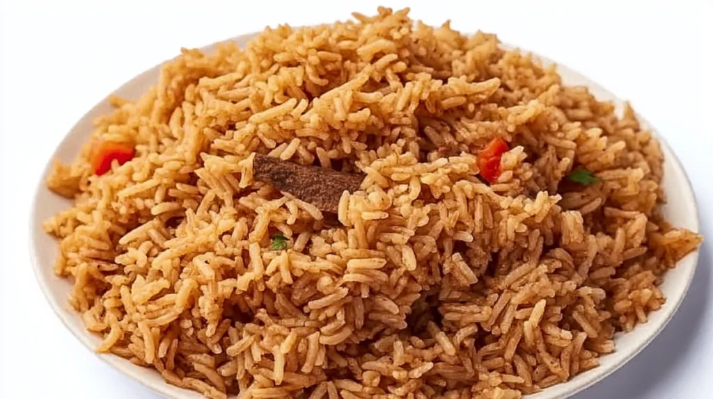 Kenyan pilau spiced rice cooked with aromatic spices, tender meat, and caramelized onions, served on a platter.