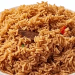 Kenyan pilau spiced rice cooked with aromatic spices, tender meat, and caramelized onions, served on a platter.