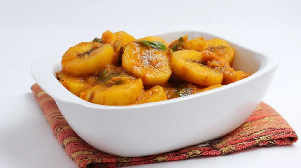 Matoke steamed plantain stew cooked with tender plantains, vegetables, and savory seasonings in a rich sauce.