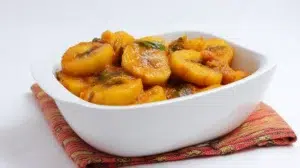 Matoke steamed plantain stew cooked with tender plantains, vegetables, and savory seasonings in a rich sauce.
