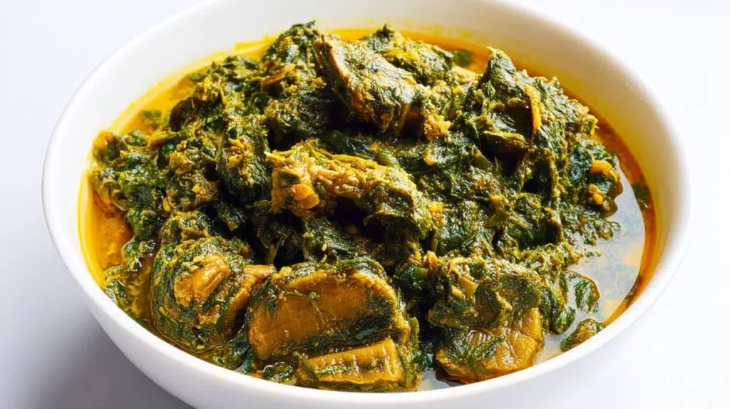 Traditional Ofe Onugbu soup served in a bowl with bitter leaf, assorted meat, and rich flavorful broth.