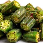 Crispy air fryer okra seasoned with spices and cooked until golden brown, served as a healthy snack or side dish.