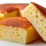 Chinese egg cake with a light fluffy texture and golden top served on a plate