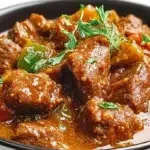 Instant Pot African lamb stew with tender lamb, vegetables, and a rich tomato-based sauce served in a bowl