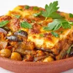 Lebanese moussaka made with tender eggplant, chickpeas, tomatoes, onions, and aromatic spices in a hearty stew.