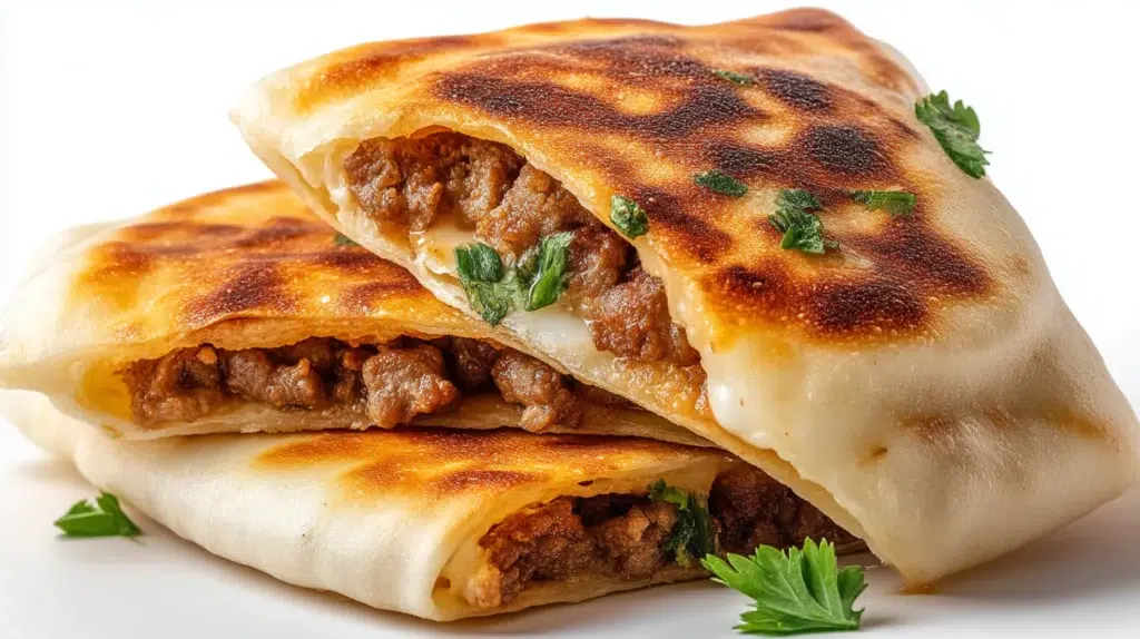 Lebanese arayes with crispy pita bread stuffed with seasoned ground meat and grilled until golden