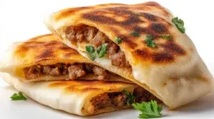 Lebanese arayes with crispy pita bread stuffed with seasoned ground meat and grilled until golden