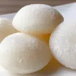 Milk mochi with a soft, chewy texture dusted with cornstarch and served in bite-sized pieces