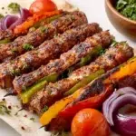 Sheet pan kebabs made with seasoned chicken and colorful vegetables roasted until tender and lightly caramelized.