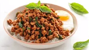 Thai basil minced pork stir-fried with garlic, chilies, and fresh Thai basil, served over steamed rice.