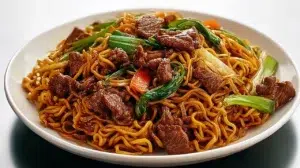 Beef pan-fried noodles with tender beef, crispy noodles, colorful vegetables, and a savory stir-fry sauce