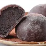 Chocolate mochi with a soft chewy texture and rich chocolate filling dusted with cocoa powder