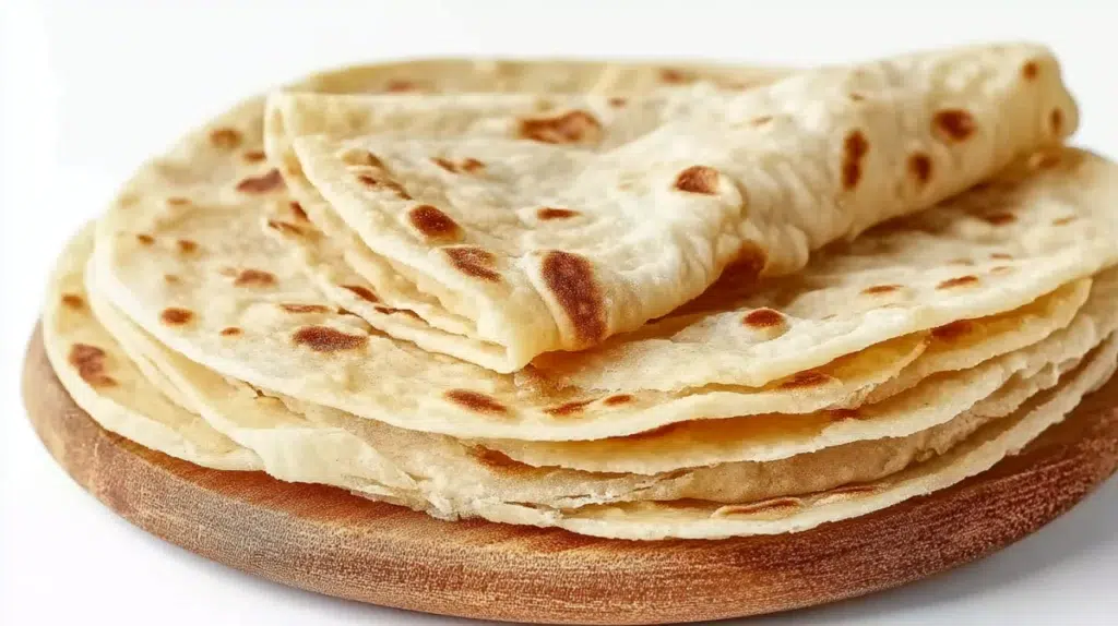 East African chapati with golden flaky layers cooked on a skillet and served warm