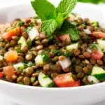 Lebanese lentil salad with cooked lentils, fresh parsley, tomatoes, onions, and a lemon dressing
