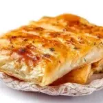 Turkish börek made with flaky pastry filled with cheese, spinach, or seasoned meat and baked until golden