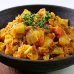 African cabbage stew with tender cabbage, tomatoes, vegetables, and aromatic spices served in a bowl