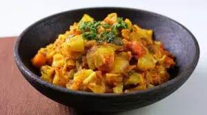 African cabbage stew with tender cabbage, tomatoes, vegetables, and aromatic spices served in a bowl